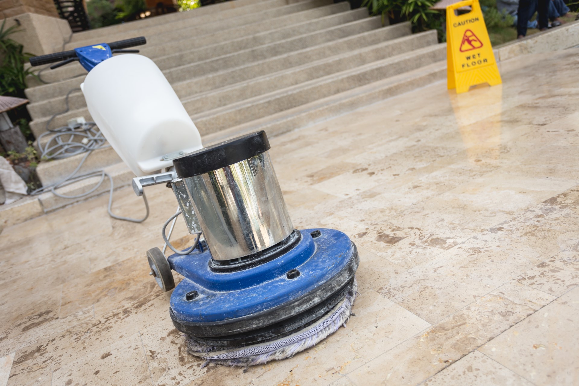 Close up blue polishing machine on the stone floor